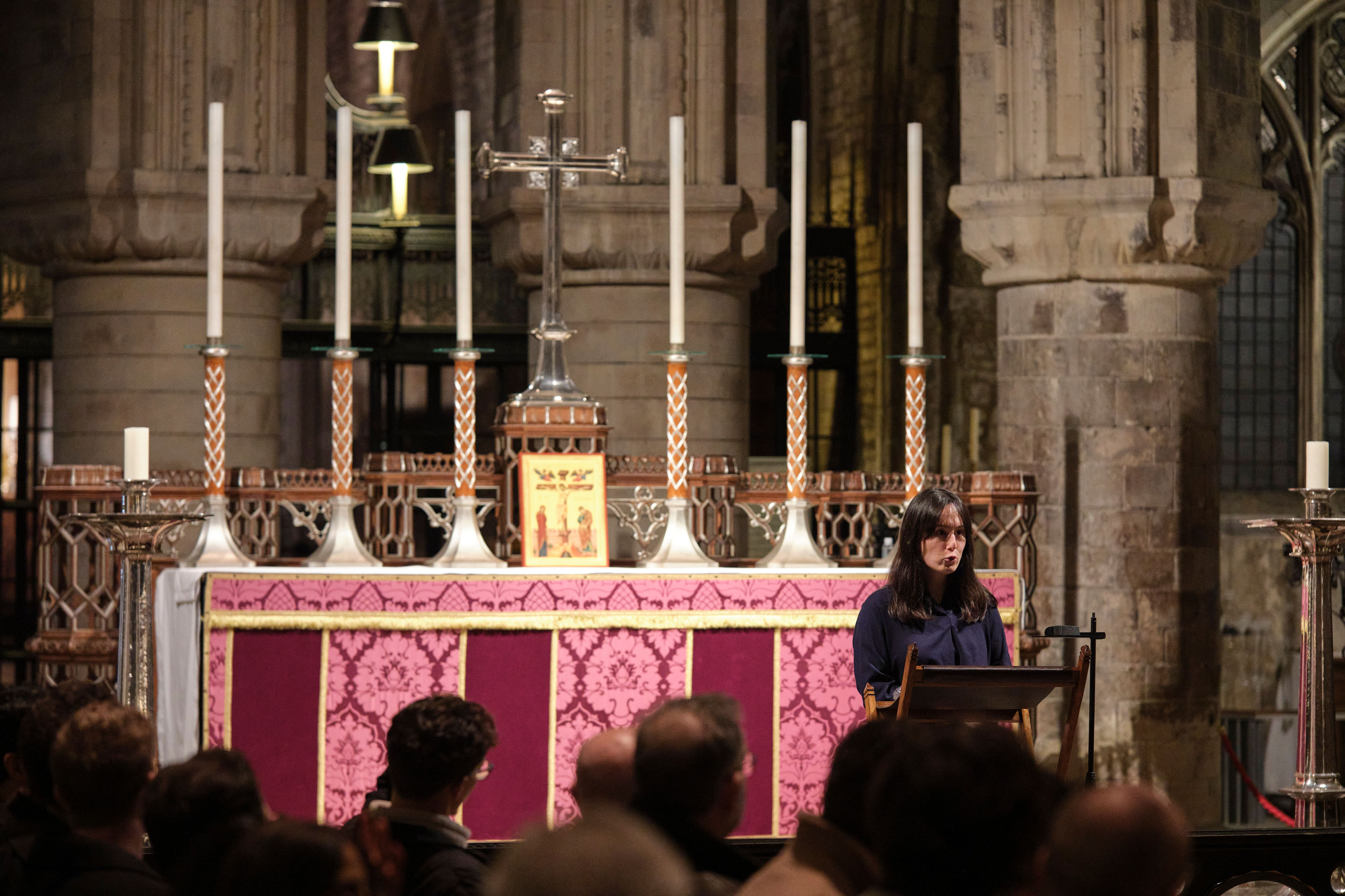 Lily Geidelberg speaking at a lectern